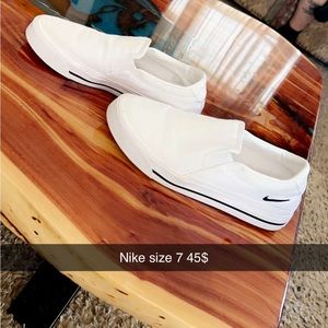 White Nike slip ons size 6 fits like a 7 barely worn